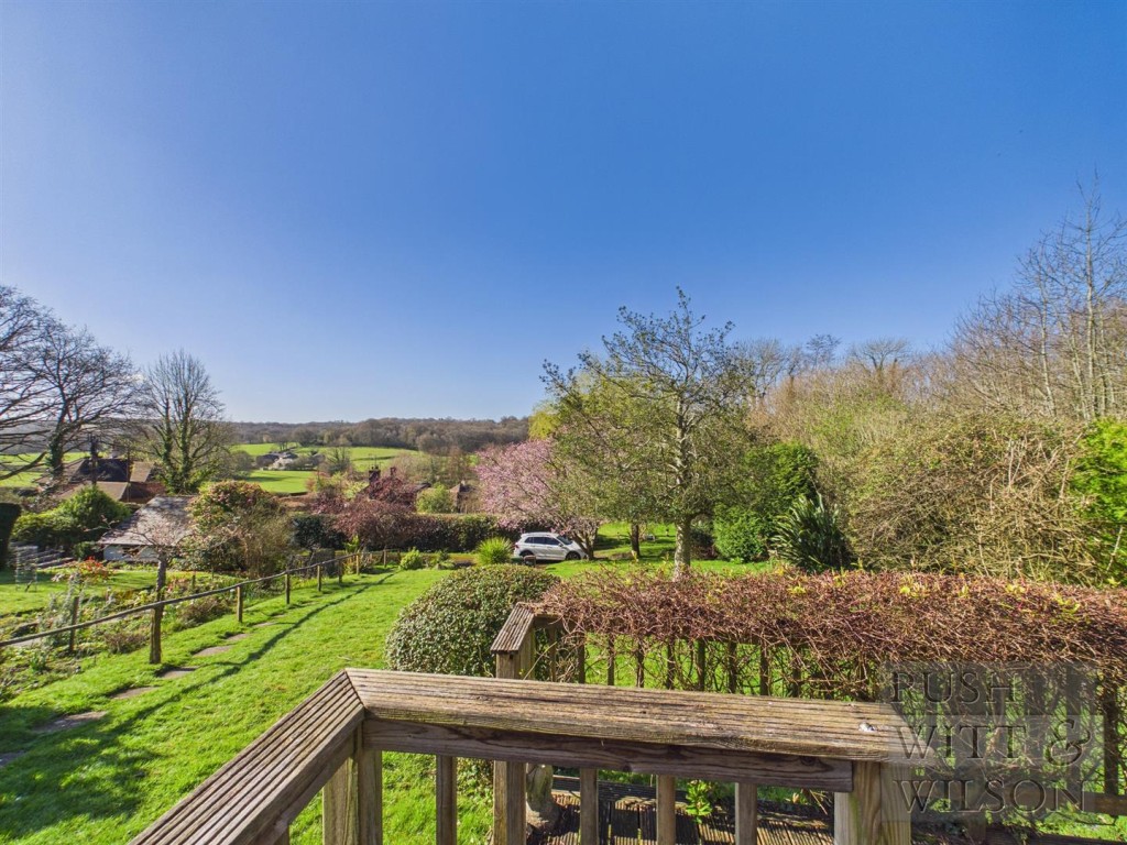 Lot: 123 - SEMI-DETACHED COTTAGE FOR REFURBISHMENT WITH FAR REACHING VIEWS - View of front garden and further views of countryside